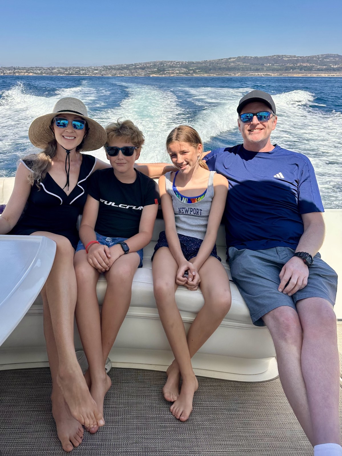 Family on the bow on a sunny day